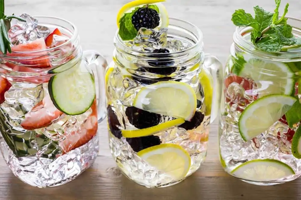 Jars with fruit infused water perfect to drink on keto diet